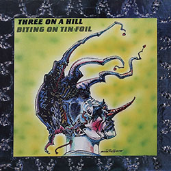 Three on a Hill - Biting on Tin Foil
